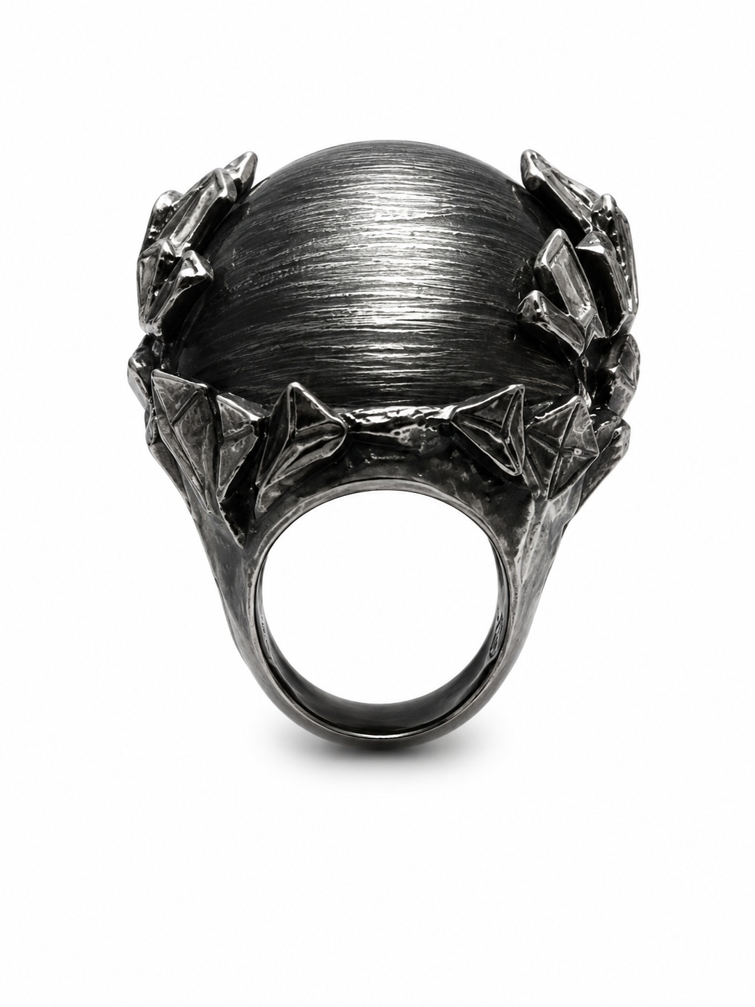 A dark gunmetal gray ring featuring a large, textured spherical top flanked by sculpted, leaf-like side details, shown on a plain white background.