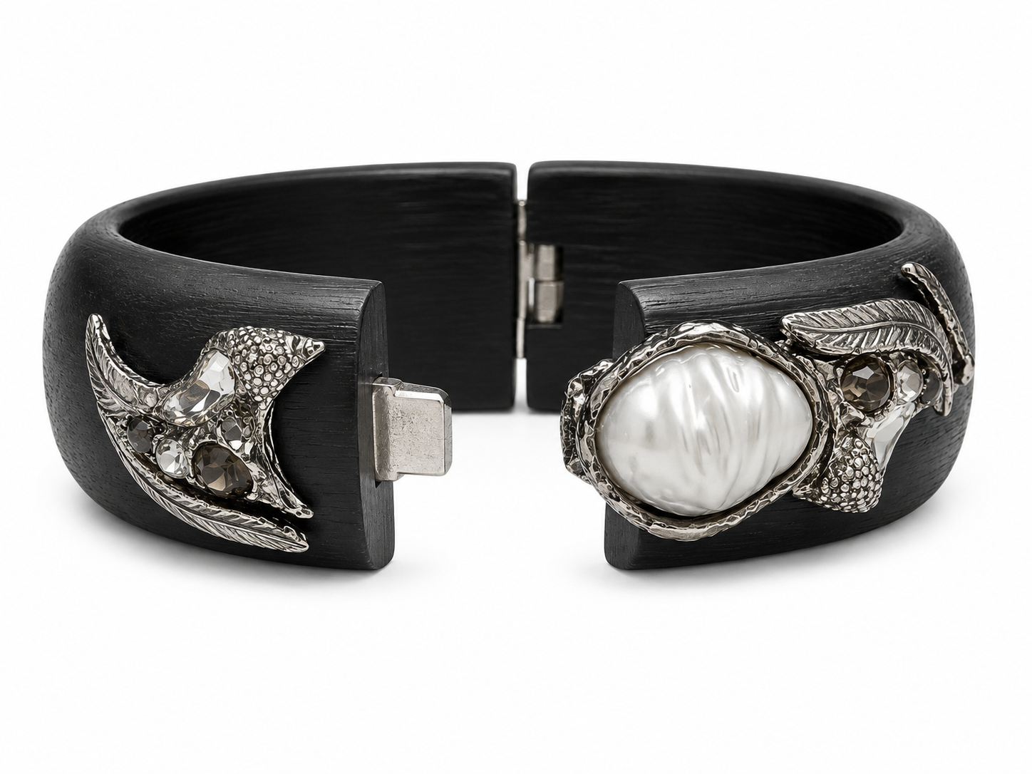 A black cuff bracelet featuring a large white baroque pearl in a silver-toned setting on one side and a silver-toned crescent moon with textured details on the other, shown against a plain white background.