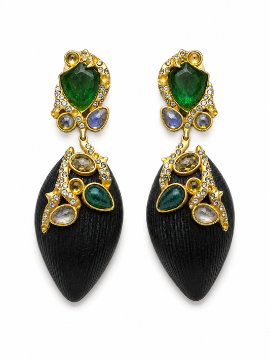 A pair of gold and black teardrop dangle earrings with green emerald-cut stones, small iridescent blue stones, and clear crystal accents, shown on a plain white background.