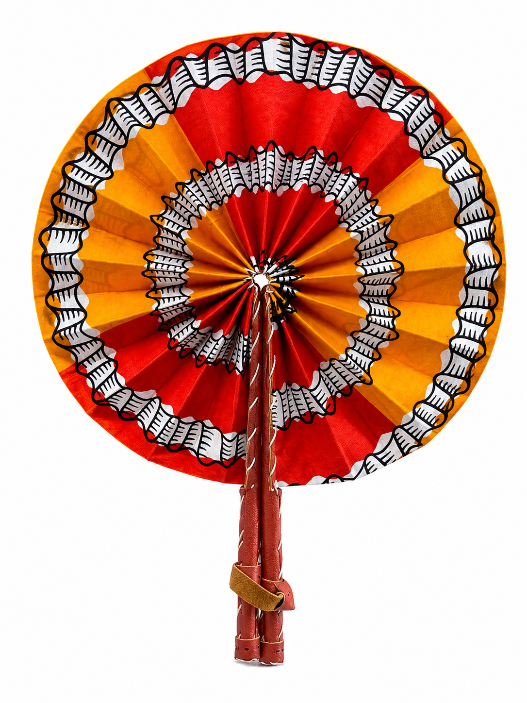 A traditional African hand fan with concentric rings of red, orange, and yellow patterned fabric, featuring black and white geometric designs, on a solid white background.
