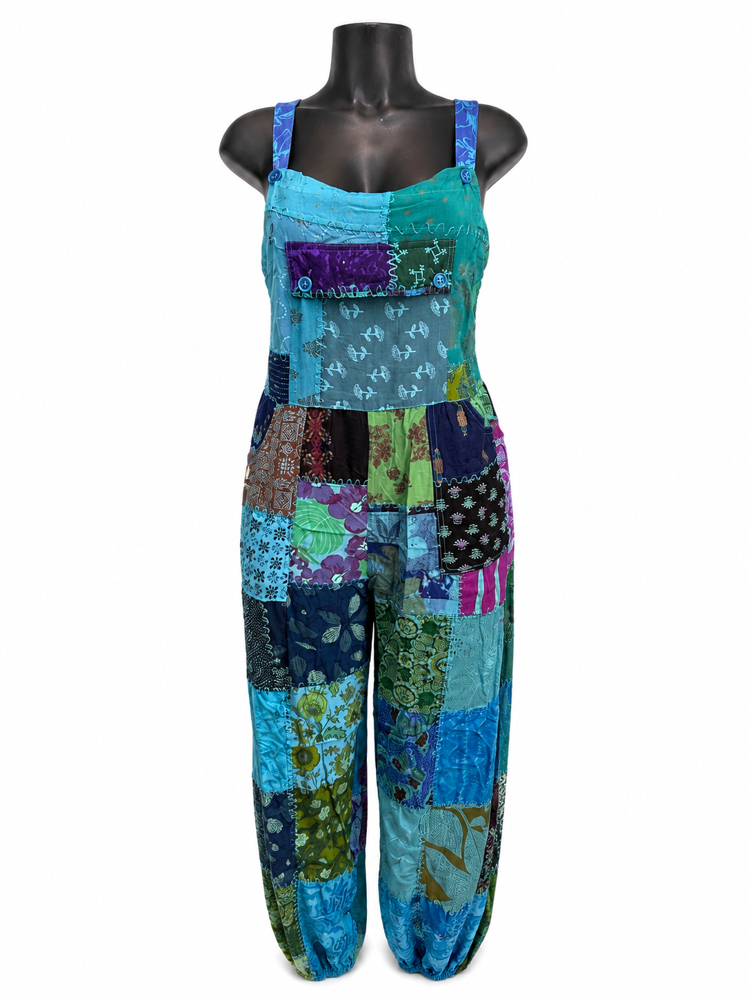 A handcrafted African Patchwork Jumpsuit, designed for comfort, creativity, and effortless style. Featuring a vibrant mix of colorful patchwork fabrics, every piece is uniquely crafted, making no two jumpsuits exactly alike.