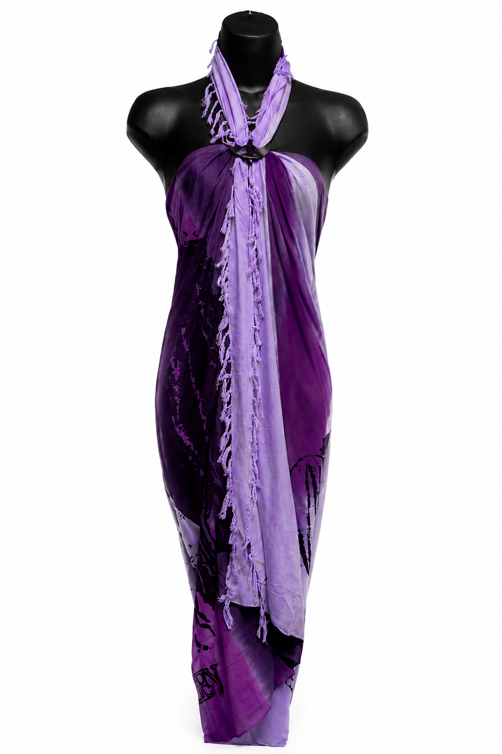A purple and lavender halter wrap sarong with fringe trim, displayed on a black mannequin torso against a white background.